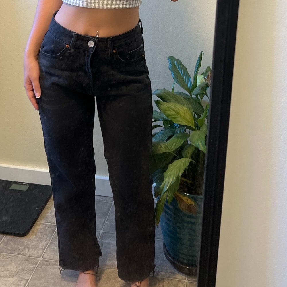 Slightly flared; Black distressed mom fit jeans